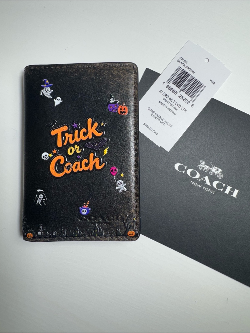 Coach Halloween ID card holder wallet with orange 'Trick or Coach' text and Hall